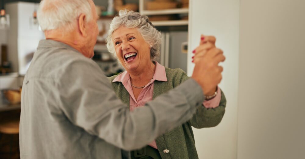 A happy couple dancing together