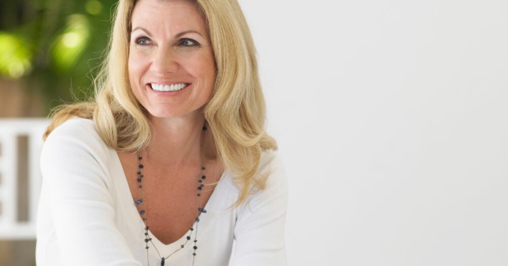 Confident smiling woman feeling energized and balanced